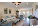 Bright and airy living room with light colored furniture and hardwood floors at 2810 Cook Circle # A, Myrtle Beach, SC 29577