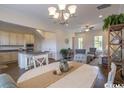 Open concept dining room with a round table and adjacent kitchen at 2810 Cook Circle # C, Myrtle Beach, SC 29577