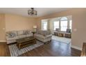 Spacious living room with sunroom and hardwood floors at 4370 Crepe Myrtle Ct. # F, Murrells Inlet, SC 29576