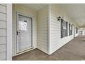 Private condo entrance with a covered walkway at 5040 Windsor Green Way # 302, Myrtle Beach, SC 29579