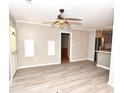 Bright living room features hardwood floors and ceiling fan at 553 Martin Luther King Rd., Pawleys Island, SC 29585