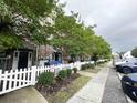 Townhouse with white picket fence and landscaping at 3564 Saint James Ave. # A B, Myrtle Beach, SC 29577