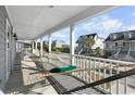 Front porch with hammock, offering a relaxing ocean view at 619 Springs Ave., Pawleys Island, SC 29585