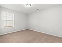 Empty bedroom with neutral carpet and single window at 879 Owls Nest Dr., Conway, SC 29527