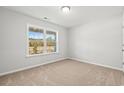 Empty bedroom with neutral-colored carpet and large window at 879 Owls Nest Dr., Conway, SC 29527