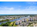 Aerial view of a waterfront community with lush landscaping and parking at 2151 Bridgeview Ct. # 3501, North Myrtle Beach, SC 29582