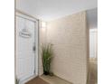 Building entrance with a white door and potted plant at 2151 Bridgeview Ct. # 3501, North Myrtle Beach, SC 29582