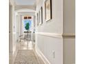 Bright hallway with art and view to ocean from sitting area at 122 Vista Del Mar Ln. # 2-302, Myrtle Beach, SC 29572