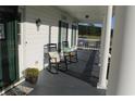 Front porch with rocking chairs and fall decor at 1409 Arbor Rd., Loris, SC 29569