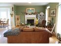 Living room with fireplace and leather sofa at 1409 Arbor Rd., Loris, SC 29569