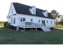 White farmhouse with deck and backyard at 1409 Arbor Rd., Loris, SC 29569