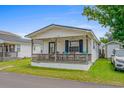 Cute cottage with front porch and string lights at 6001-5137 S Kings Hwy., Myrtle Beach, SC 29575