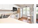 Small kitchen with white cabinets and appliances at 1065 Pinwheel Loop # 1065, Myrtle Beach, SC 29577