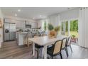 Bright dining area with white table and chairs, adjacent to kitchen at 2628 Riverboat Way, Conway, SC 29526
