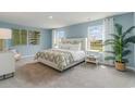 Spacious main bedroom with light blue walls and a white bed at 2628 Riverboat Way, Conway, SC 29526