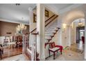 Elegant entryway with grand staircase, ornate doors, and chandelier at 153 Palmetto Harbour Dr., North Myrtle Beach, SC 29582
