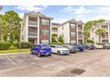 Brick building exterior with multiple levels and balconies at 472 River Oaks Dr. # 65C, Myrtle Beach, SC 29579