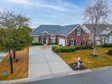 Property view showcasing house, driveway, and surrounding landscape at 776 Wigston Ct., Myrtle Beach, SC 29579