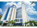 Oceanfront high-rise building with palm trees and parking at 2004 N Ocean Blvd. # 771, Myrtle Beach, SC 29577