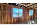 Under-construction bedroom with large window offering water views at 1817 Woodstork Dr., Conway, SC 29526