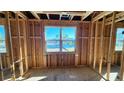 Under-construction bedroom with large window offering water views at 1817 Woodstork Dr., Conway, SC 29526
