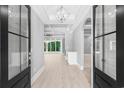 Elegant entryway with double doors and a chandelier at 1847 Woodstork Dr., Conway, SC 29526