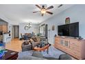 Comfortable living room with seating area, TV, and dining area view at 1301 Sweetwater Blvd. # 1301, Murrells Inlet, SC 29576
