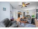 Spacious living room featuring a comfortable couch and a dining area at 1301 Sweetwater Blvd. # 1301, Murrells Inlet, SC 29576