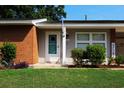 Charming brick home with a welcoming front porch and landscaping at 530 Swallow Ave. # 530, Myrtle Beach, SC 29577