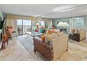 Living room with comfortable seating, large windows, and ocean views at 517 S Ocean Blvd. # 705, North Myrtle Beach, SC 29582