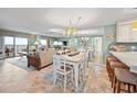 Open living and dining area with ocean views and coastal decor at 517 S Ocean Blvd. # 705, North Myrtle Beach, SC 29582