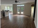 Spacious living room with hardwood floors and access to a backyard at 3609 White Oleander Ct., North Myrtle Beach, SC 29582