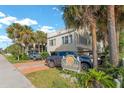 Two-story beach house with parking and palm trees at 4314 S Ocean Blvd. # B-1, North Myrtle Beach, SC 29582