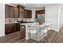 Modern kitchen with island and stainless steel appliances at 782 Cypress Preserve Circle, Longs, SC 29568