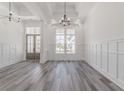 Bright dining room with hardwood floors and wainscoting at 1302 Surf Pointe Dr., North Myrtle Beach, SC 29582