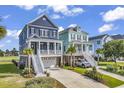 Two-story home with attached garage and large yard at 312 West Palms Dr., Myrtle Beach, SC 29579