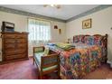 Cozy bedroom featuring a double bed, dresser, and window at 213 Birkdale Ln., Myrtle Beach, SC 29588