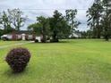 Brick ranch house with a spacious lawn and mature trees at 880 Horry Rd., Aynor, SC 29511