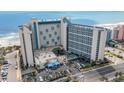 Aerial view of the oceanfront hotel and its amenities at 7100 N Ocean Blvd. # 320, Myrtle Beach, SC 29572