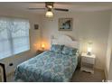 Cozy bedroom with a queen-size bed and calming decor at 1521 N Waccamaw Dr., Murrells Inlet, SC 29576