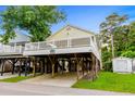 Elevated beach house with a spacious deck and parking underneath at 6001 - 1550 S Kings Hwy., Myrtle Beach, SC 29575