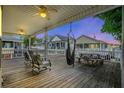 Spacious deck with seating, a hammock, and picnic table at 6001 - 1550 S Kings Hwy., Myrtle Beach, SC 29575