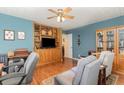 Home office with built-in shelving, hardwood floors, and comfortable seating at 60 Wraggs Ferry Rd., Georgetown, SC 29440