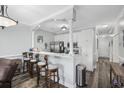Modern kitchen with white cabinets, breakfast bar, and stainless steel appliances at 4503 W Harbour Circle # S1, Little River, SC 29566