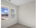 Bright bedroom with neutral walls and carpeting at 3050 Deerberry Place, Longs, SC 29568