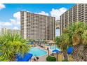 Resort-style pool area with ample lounge chairs and a lively atmosphere at 100 North Beach Blvd. # 1512, North Myrtle Beach, SC 29582