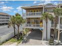 Front view of beach house with parking at 919A N Waccamaw Dr., Murrells Inlet, SC 29576