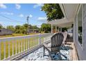 Spacious front porch with two chairs, overlooking the street at 2403 Park St., North Myrtle Beach, SC 29582