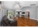Open living room with hardwood floors, vaulted ceiling, and view of kitchen at 1225 White Fox Ct., Conway, SC 29526