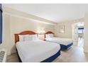 Bedroom with two twin beds, nightstands, and wood dresser at 2300 N Ocean Blvd. # 238, Myrtle Beach, SC 29577